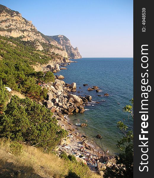 Aya cape is located in the Black sea near Balaklava, not far from Sevastopol. On the shore, strew by stones, they rest and bathe in the sun people. On this sea shore it is good to rest during leave.