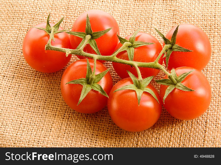 Branch of seven small tomatoes. Branch of seven small tomatoes