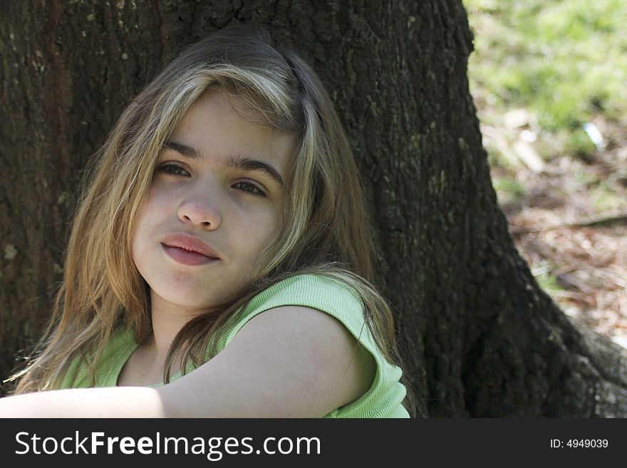 Girl Against Tree