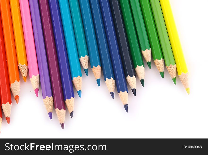 Multicolored pencil on white background