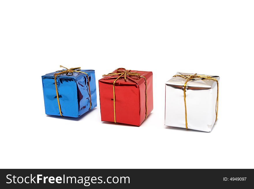 Three boxes with gifts on a white background