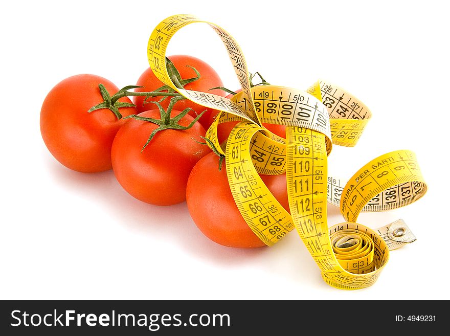 Measuring tape around red tomatoes
