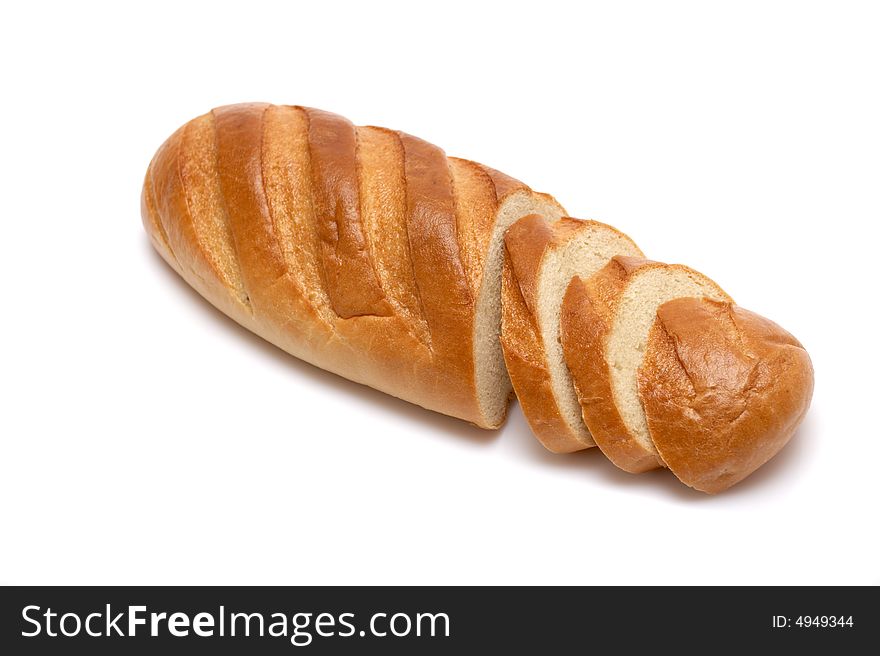 The bread cut on slices on a white background
