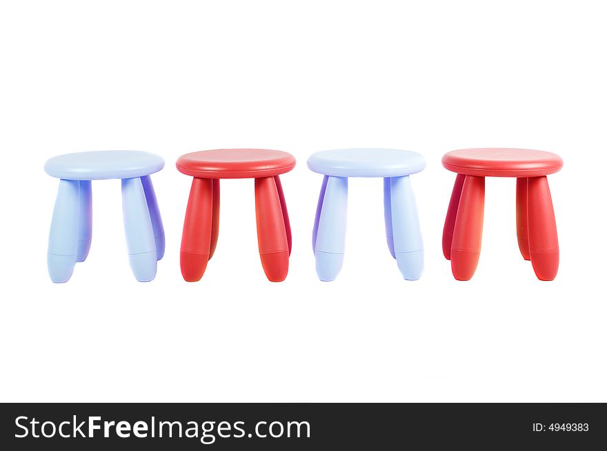 Four colored stools isolated on white