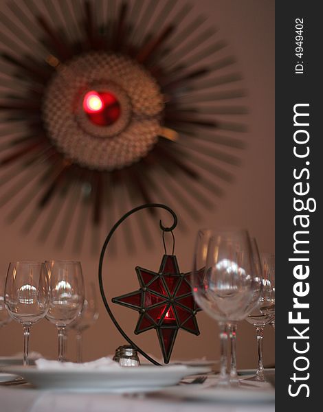 Restaurant table served for fore people Italian style Lamp in red star shape on centre of table. Restaurant table served for fore people Italian style Lamp in red star shape on centre of table