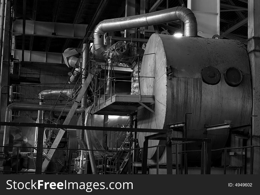 Equipment, cables and piping as found inside of a modern industrial power plant