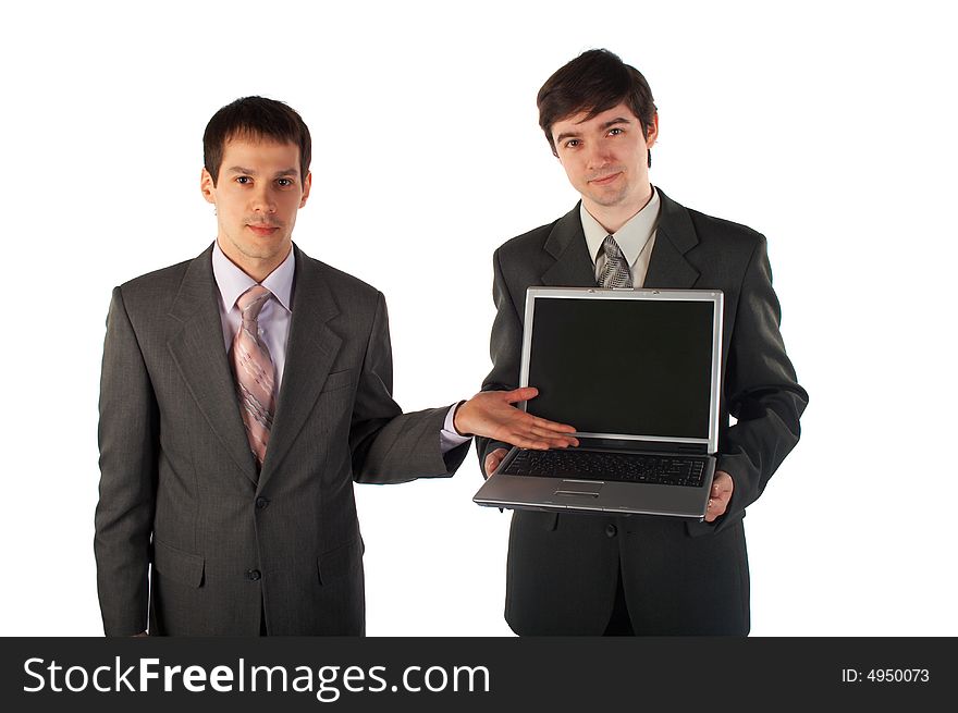 Two young businessmen show laptop isolated on white