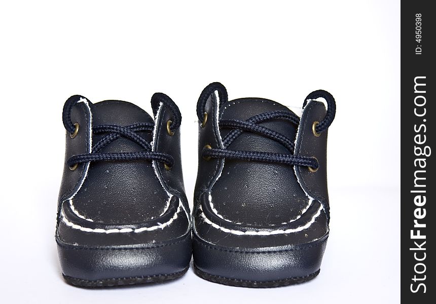A pair of baby shoes isolated on a white background.