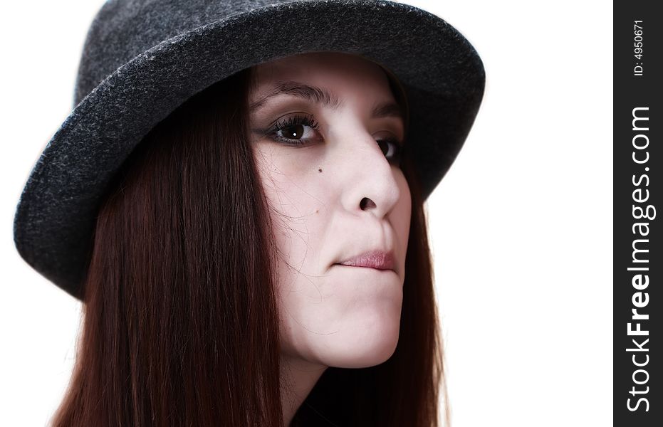 Portrait of a pretty young girl dressed in a hat on white background. Portrait of a pretty young girl dressed in a hat on white background