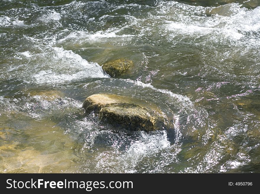 Stream background. River and rocks