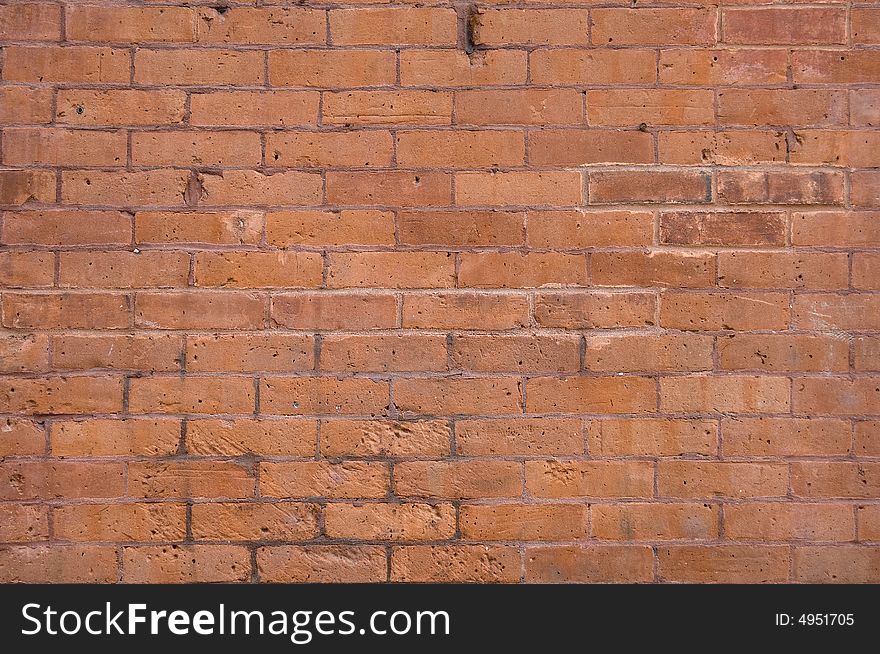 Light red brick wall that could be used for a background. Light red brick wall that could be used for a background