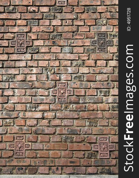 Dark brown red brick wall that could be used for a background.