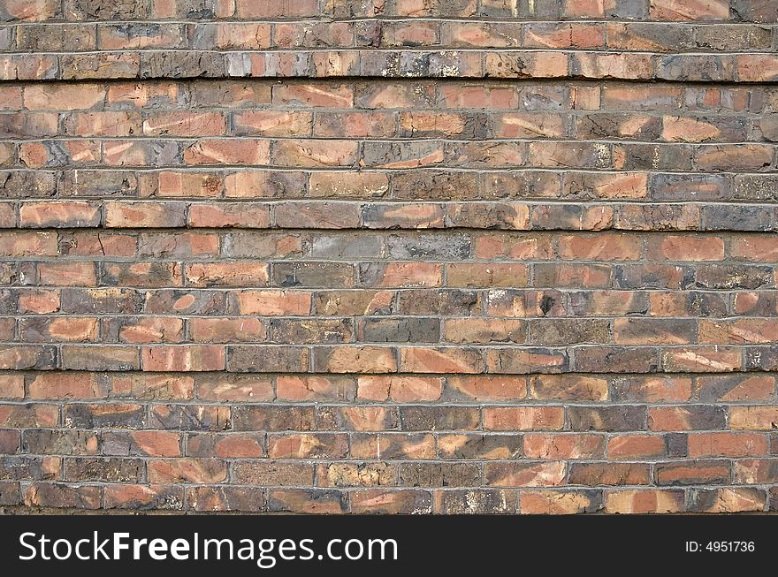 Multi colored brick wall that could be used for a background. Multi colored brick wall that could be used for a background