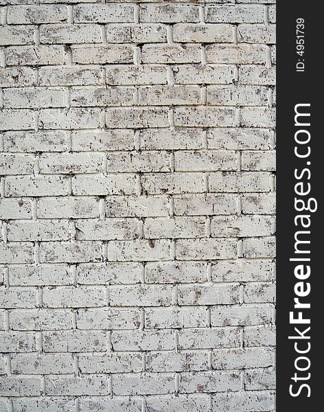 Light gray brick wall that could be used for a background. Light gray brick wall that could be used for a background