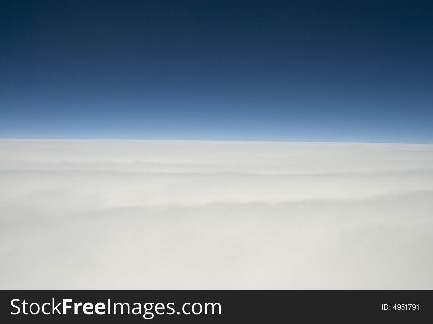 Clouds and blue sky seen from the plane