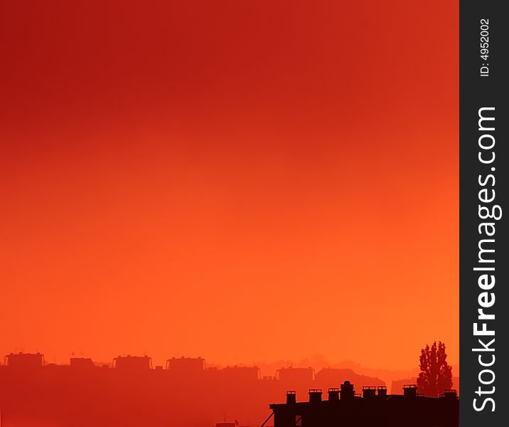 An orange misty view of a cityscape