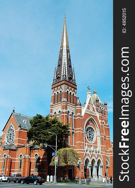 A historic church at a busy street in downtown victoria, british columbia