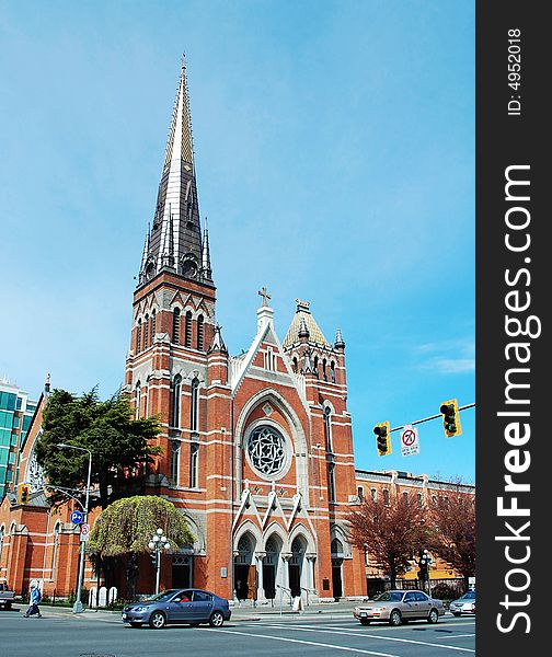 A historic church at a busy street in downtown victoria, british columbia