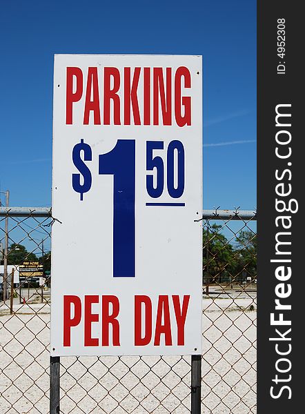 Parking lot sign one dollar and fifty centers per day