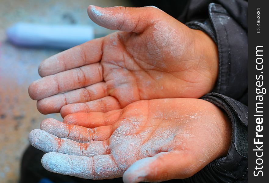 A childs hands after playing with sidewalk chalk. A childs hands after playing with sidewalk chalk