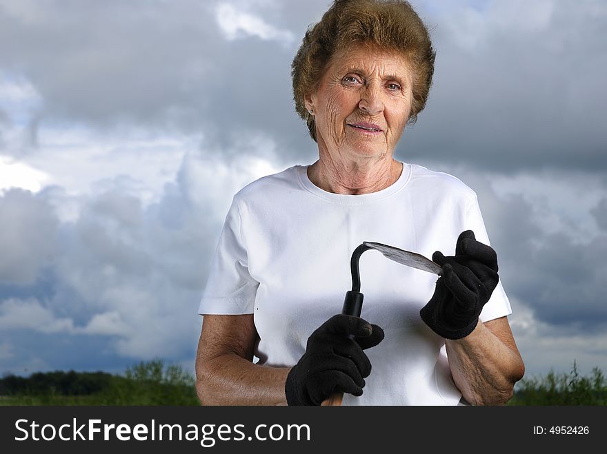 An active eighty year old, working on her farm. An active eighty year old, working on her farm