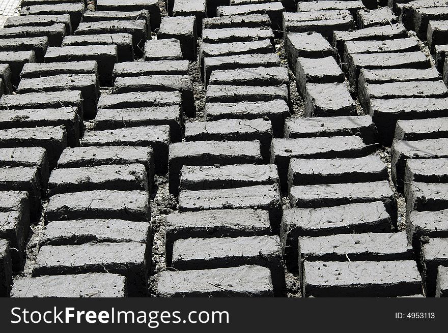 Mud bricks drying in sun at a Buddhist monastery in Ladakh, Northern India. Mud bricks drying in sun at a Buddhist monastery in Ladakh, Northern India