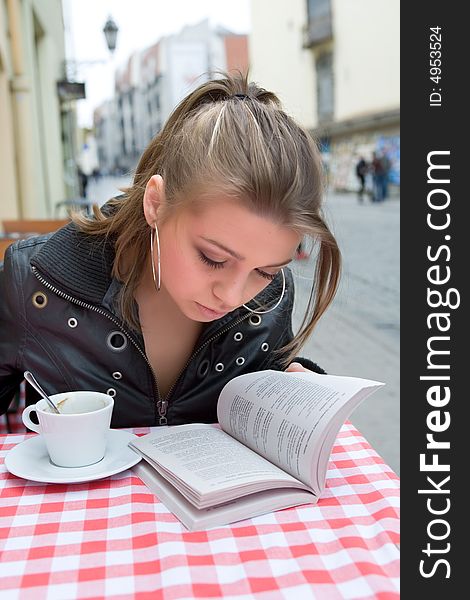 The female student in cafe street in old city. The female student in cafe street in old city