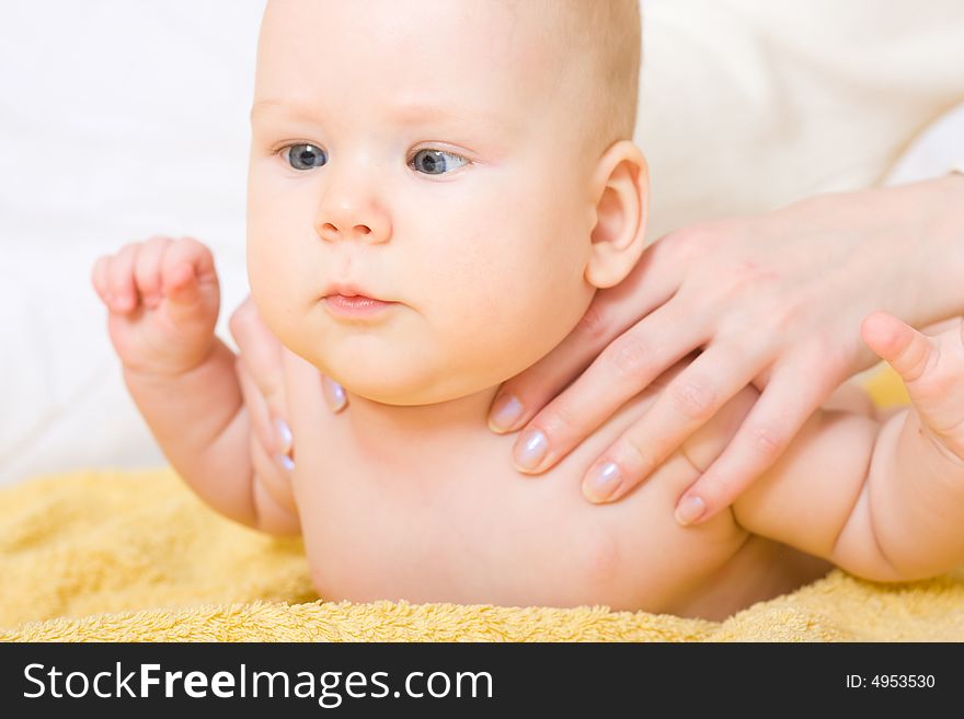 Cute six month baby on yellow blanket. Cute six month baby on yellow blanket
