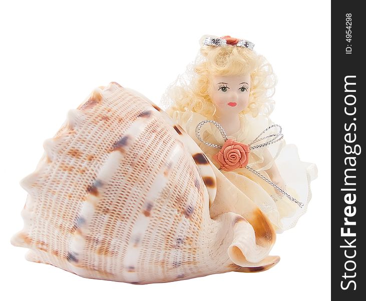 Toy girl with seashell isolated on white