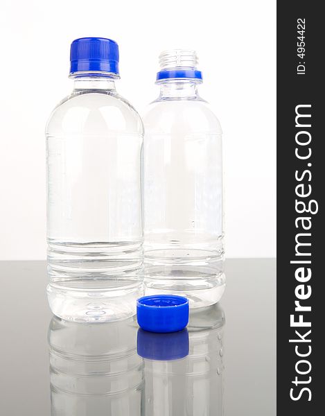 Bottled drinking water isolated against a white background. Bottled drinking water isolated against a white background