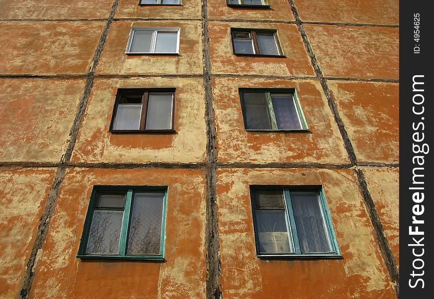 Brown color wall with windows, old house. Brown color wall with windows, old house