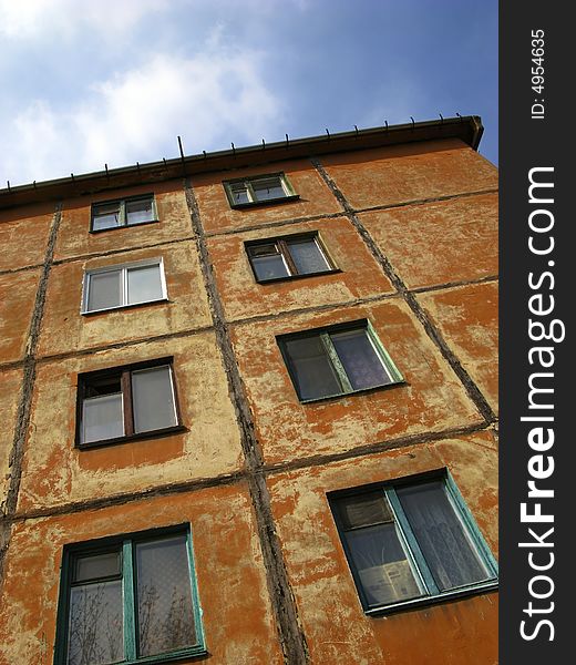 Brown color  wall with windows,  old house. Brown color  wall with windows,  old house