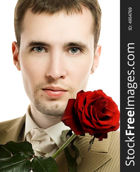 Handsome young man with a rose