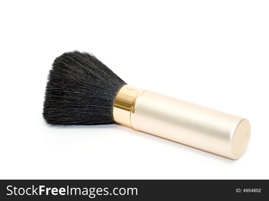 Isolated on white gold brush for make-up. Isolated on white gold brush for make-up