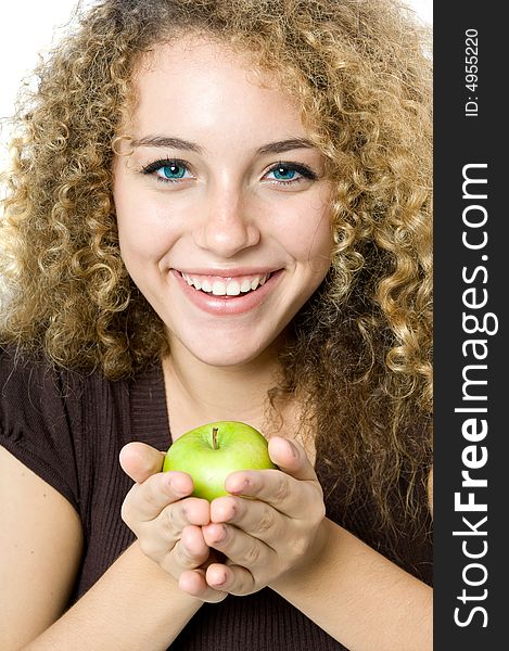 A beautiful young women holding an apple