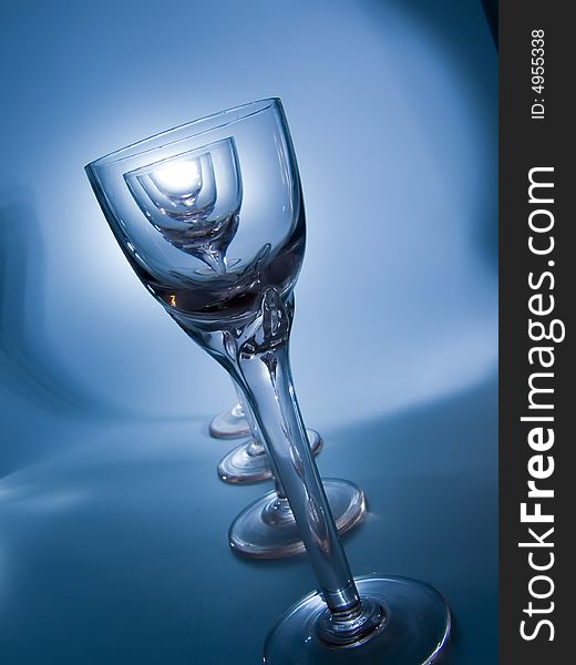 Four glass on the blue background. Four glass on the blue background