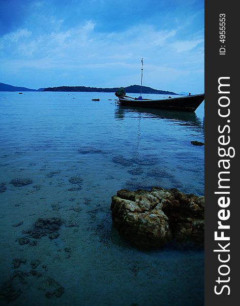 Blue Rawai Beach with a boat, Phuket, Thailand. Blue Rawai Beach with a boat, Phuket, Thailand