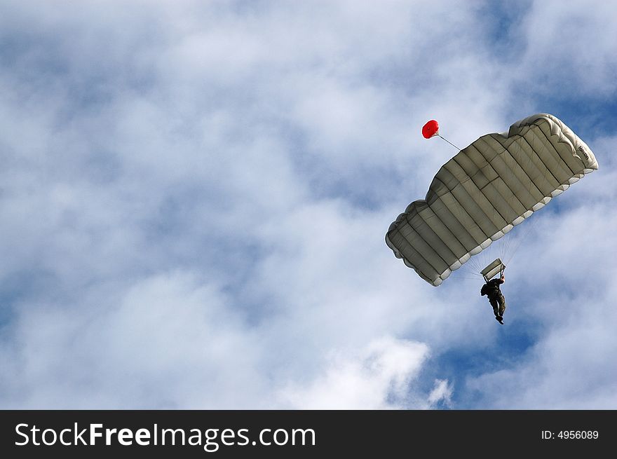 Two Parachutist solider on blue sky