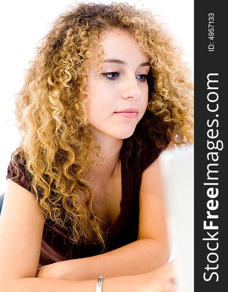 A young pretty woman with laptop computer on white background (shallow depth of field). A young pretty woman with laptop computer on white background (shallow depth of field)