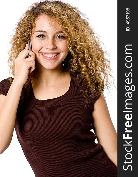 An attractive young woman with mobile phone on white background. An attractive young woman with mobile phone on white background