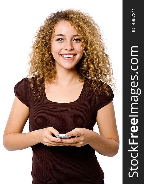 An attractive young woman with mobile phone on white background. An attractive young woman with mobile phone on white background