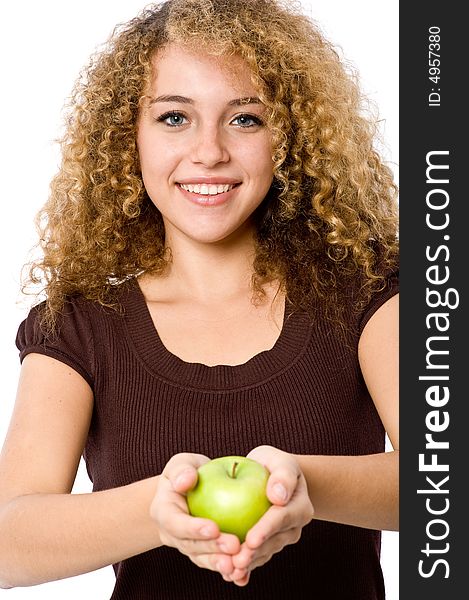 A pretty young woman holding a green apple. A pretty young woman holding a green apple