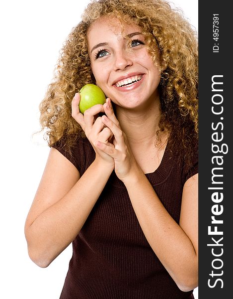 A pretty young woman holding a green apple. A pretty young woman holding a green apple