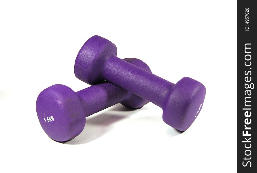 Two dumbbells of violet color in a soft environment in weight of 1,5 kg.