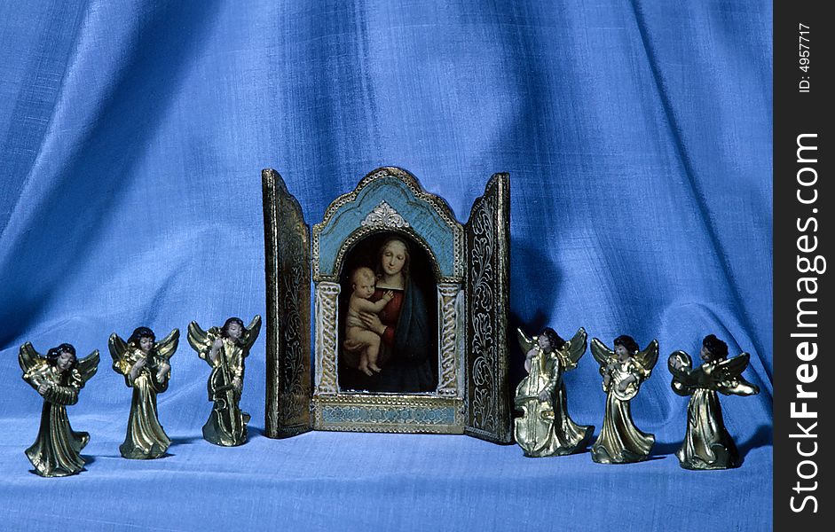 Angels surround a picture of the virgin mary. Angels surround a picture of the virgin mary