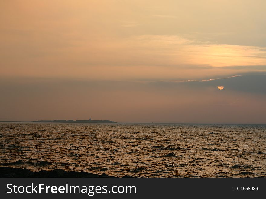 Sunrise over the bay in winter. Cold crisp day. Sunrise over the bay in winter. Cold crisp day.