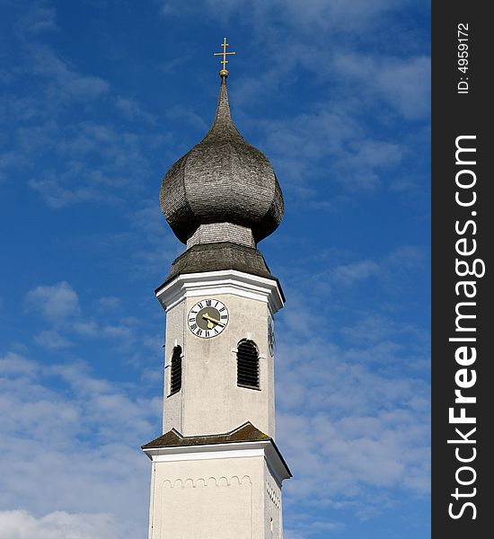 Samall Church on the background of clouds and sky. Vilaage In South Bavaria .Not so far from Munich. Samall Church on the background of clouds and sky. Vilaage In South Bavaria .Not so far from Munich.