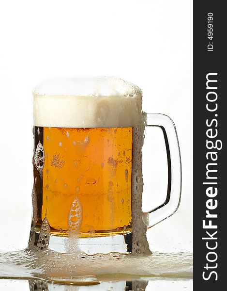 Beer in glass on the white background
