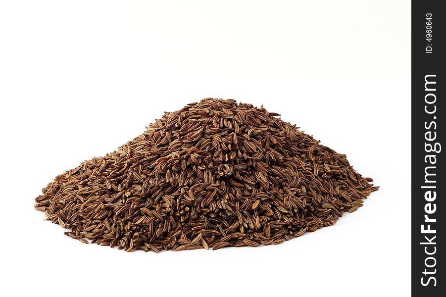 An isolated pile of caraway on white background