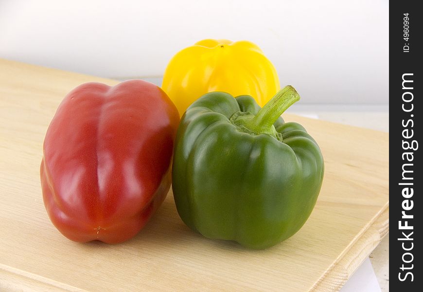 Three peppers - red, green yellow
